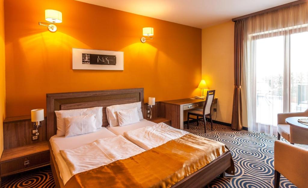 Postel nebo postele na pokoji v ubytování Sándor Hotel