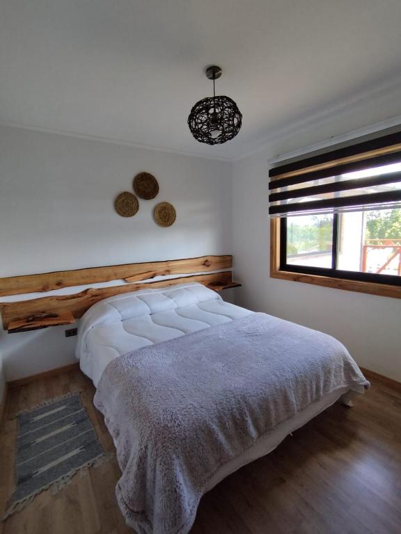 Postel nebo postele na pokoji v ubytování Hostal & Domos Bello Horizonte