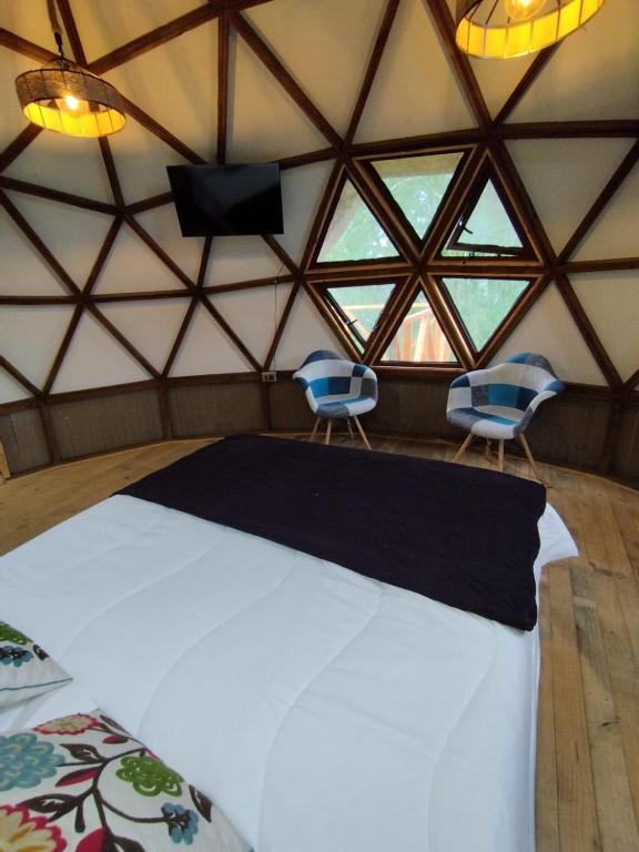 Postel nebo postele na pokoji v ubytování Hostal & Domos Bello Horizonte