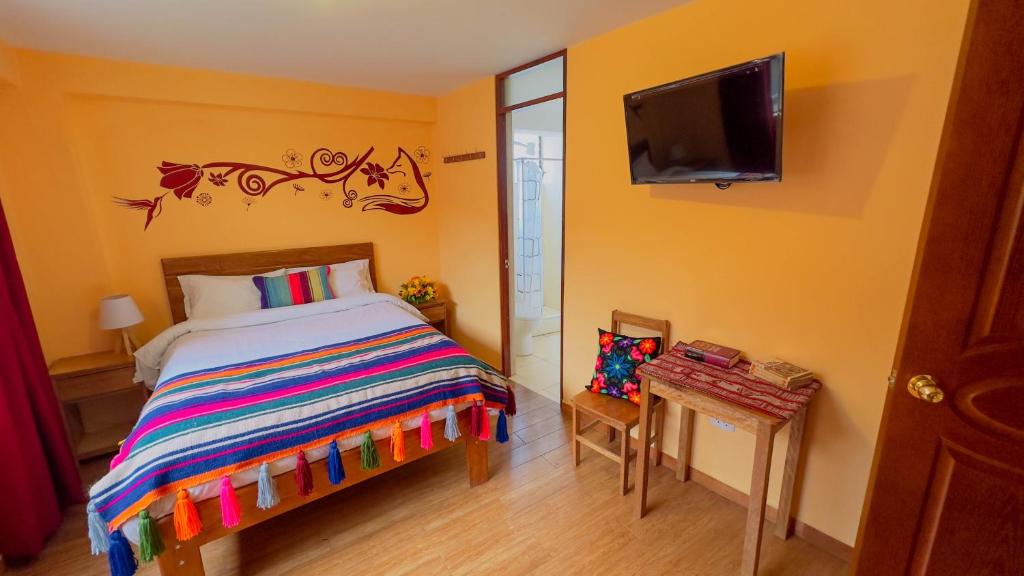 Postel nebo postele na pokoji v ubytování Andean Atoq Hostel