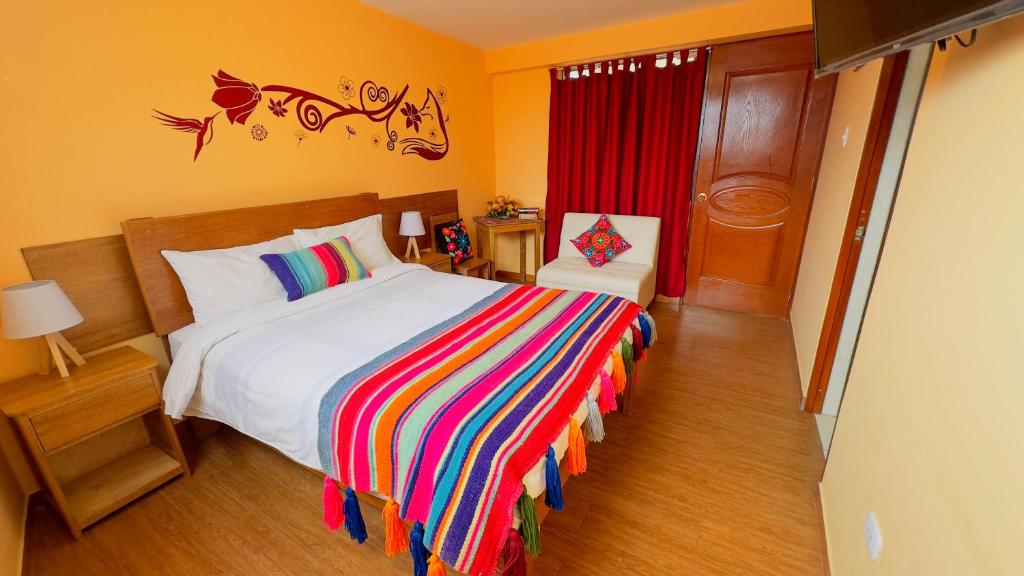 Postel nebo postele na pokoji v ubytování Andean Atoq Hostel