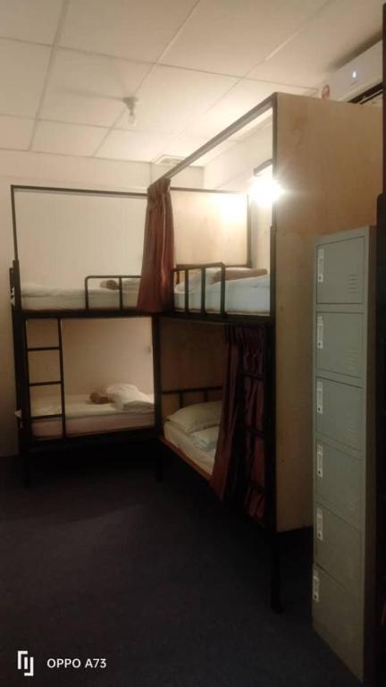 Postel nebo postele na pokoji v ubytování AeCOTEL Mingle Hostel