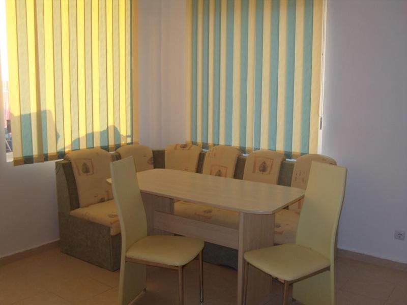 a conference room with a table and chairs at Apartment Orhideya in Sunny Beach