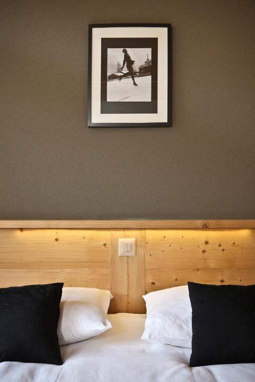 Voodi või voodid majutusasutuse Helvetia hotel toas