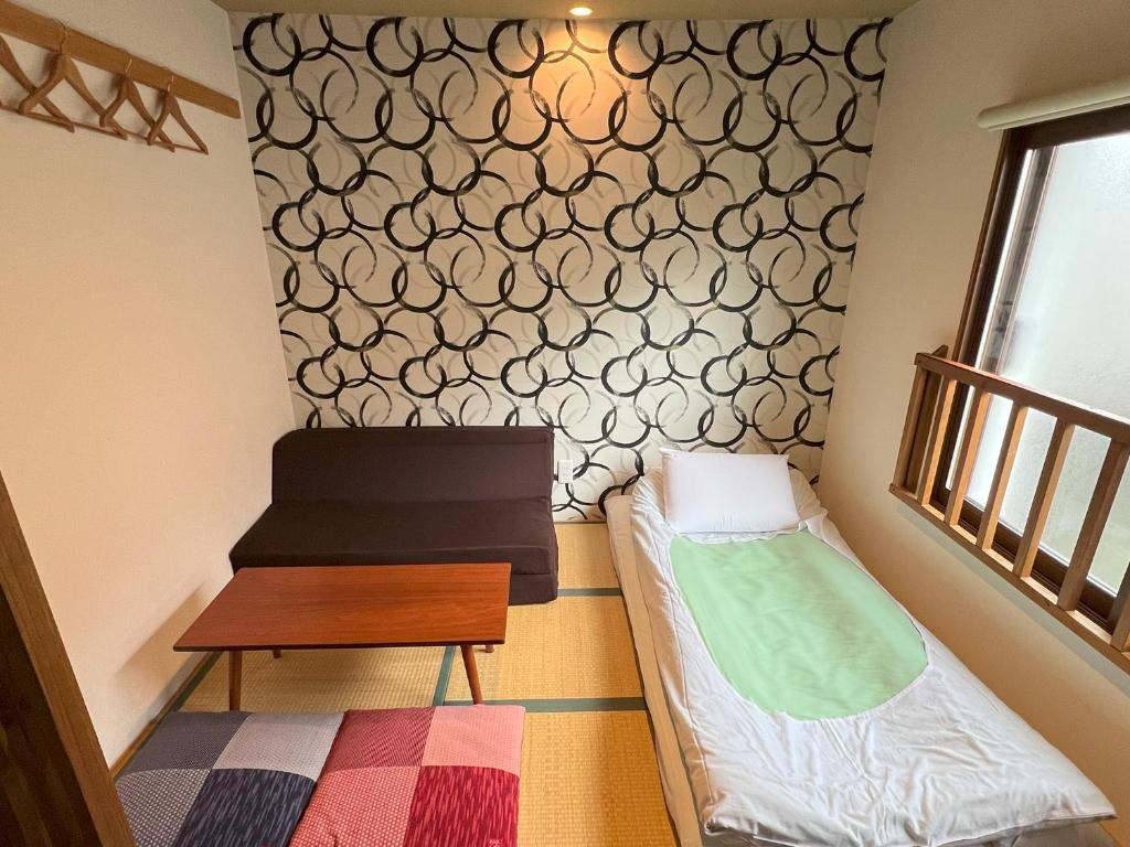 Postel nebo postele na pokoji v ubytování Guesthouse Soi