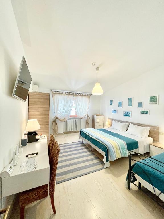 Postel nebo postele na pokoji v ubytování B&B Le Saline