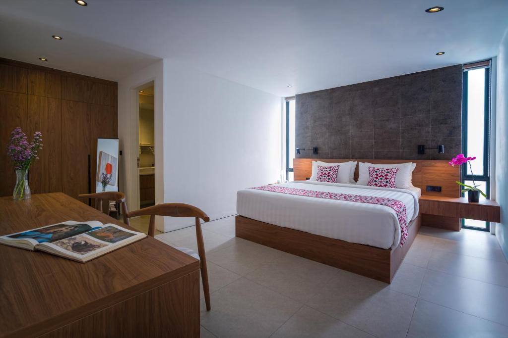 Postel nebo postele na pokoji v ubytování Umalas Creek Villas