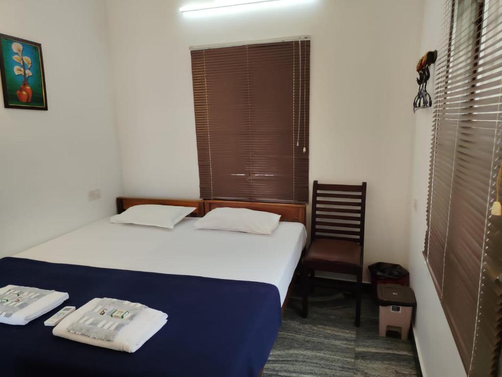 Postel nebo postele na pokoji v ubytování Janatha Homestay