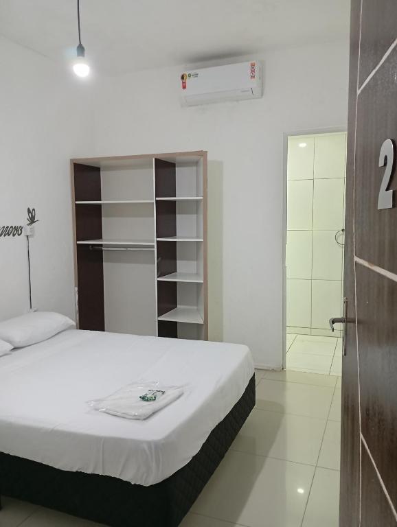 Ένα ή περισσότερα κρεβάτια σε δωμάτιο στο Pousada Morro dó Macaco ARTE