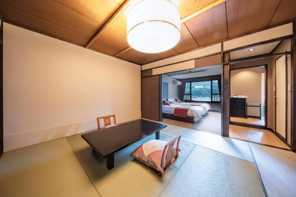 Postel nebo postele na pokoji v ubytování Inatori Akao Hotel