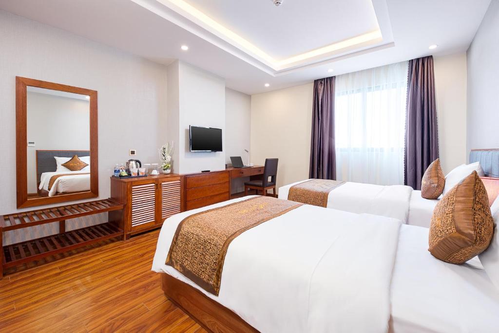 Postel nebo postele na pokoji v ubytování Mercury Apartment Danang