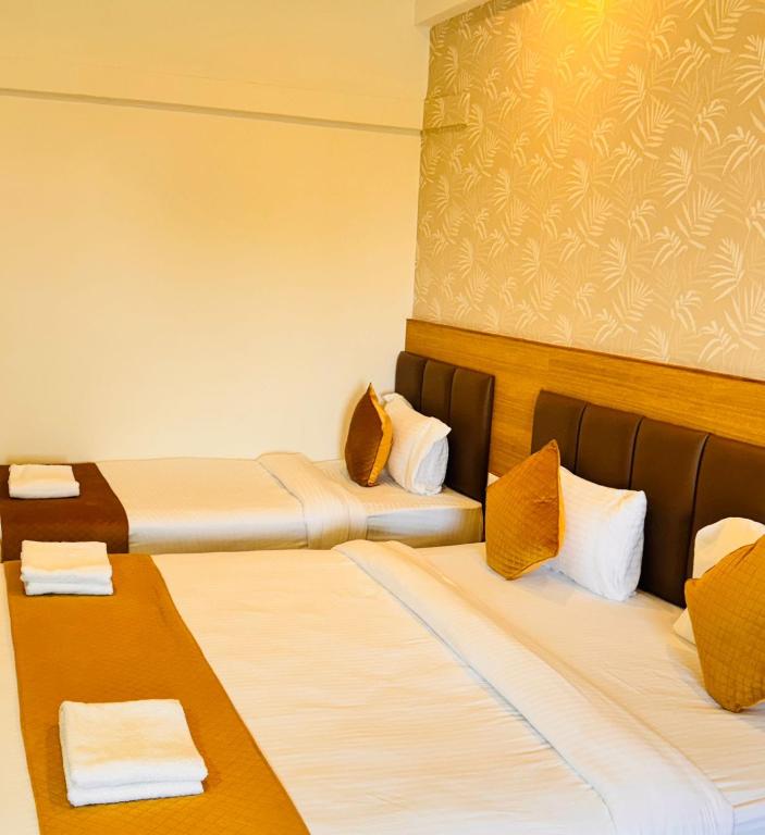 Postel nebo postele na pokoji v ubytování Bimba Hotels
