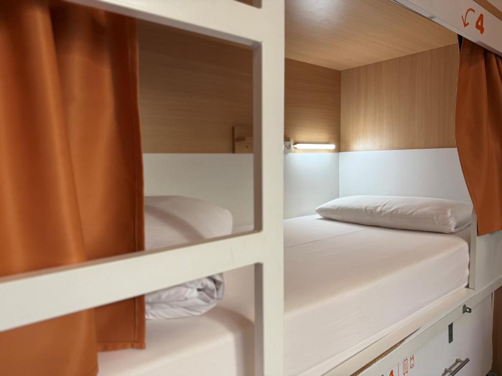 Cama ou camas em um quarto em The Loft House Barcelona