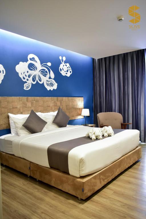 Postel nebo postele na pokoji v ubytování Slive Hotel