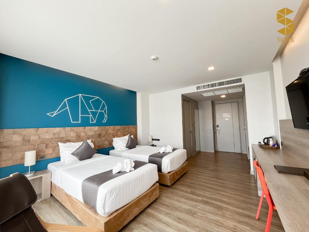 Postel nebo postele na pokoji v ubytování Slive Hotel