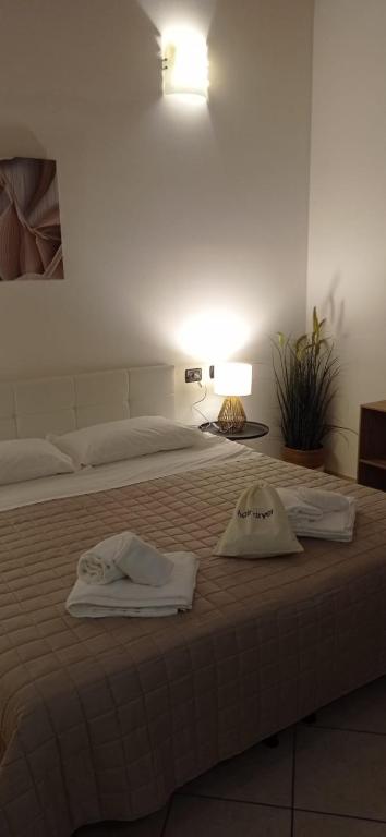 Postel nebo postele na pokoji v ubytování Hotel IL Rifugio