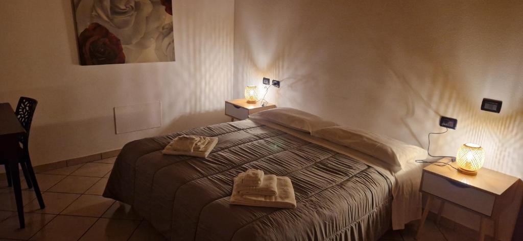 Postel nebo postele na pokoji v ubytování Hotel IL Rifugio