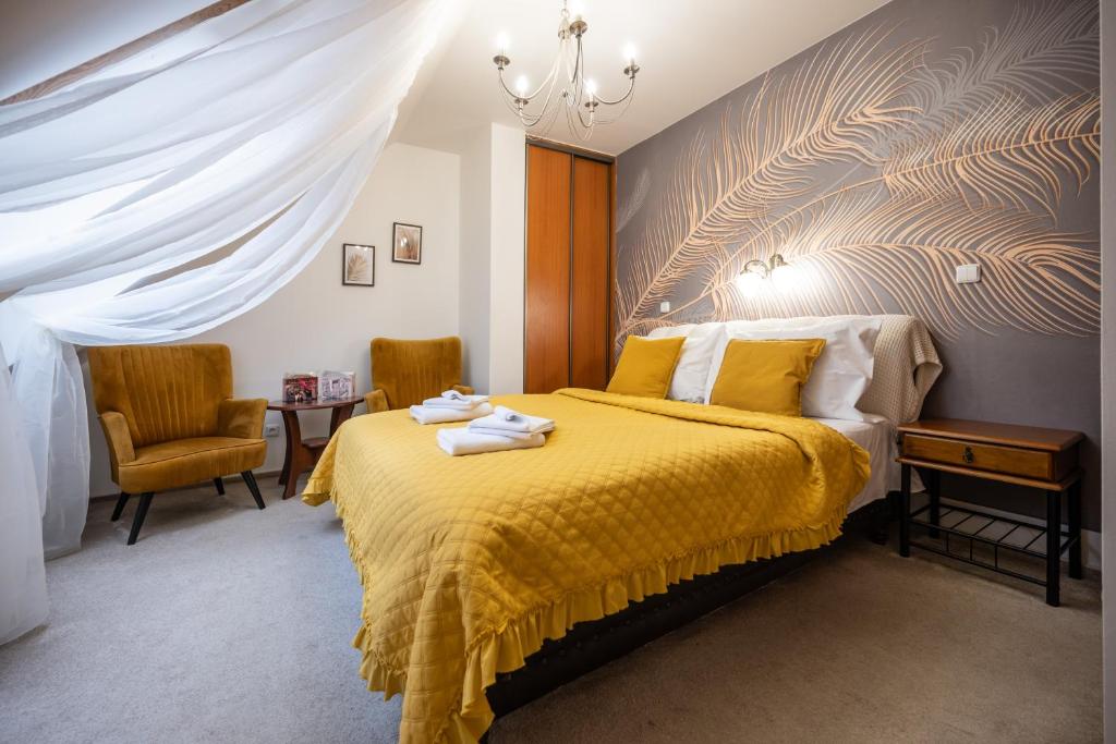 Postel nebo postele na pokoji v ubytování Hotel Litovel