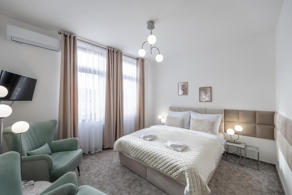 Postel nebo postele na pokoji v ubytování Hotel Litovel