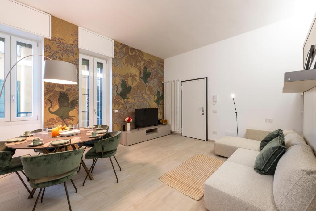 a living room with a table and a couch at Argonne 51 Spazio Argonne studio apartment in Milan