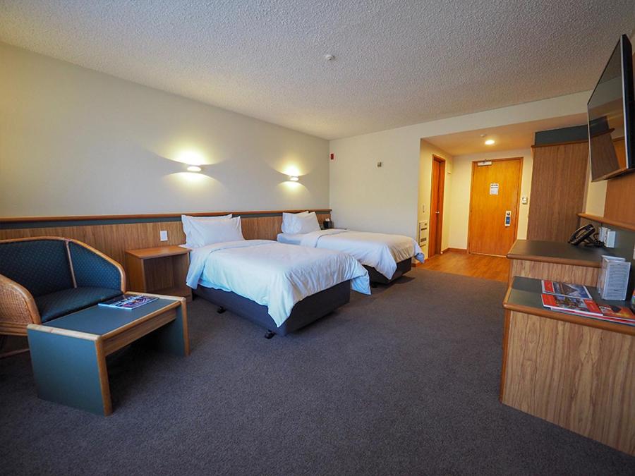 Postel nebo postele na pokoji v ubytování Swiss-Belresort and Villas Coronet Peak