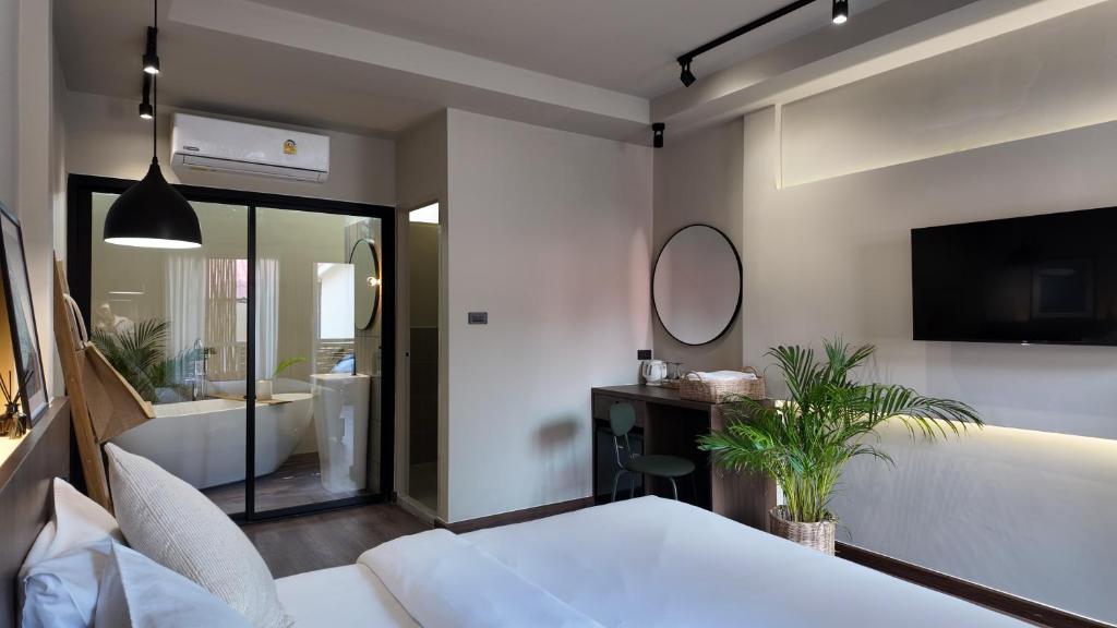 Postel nebo postele na pokoji v ubytování Suncloud Hotel Koh Samet