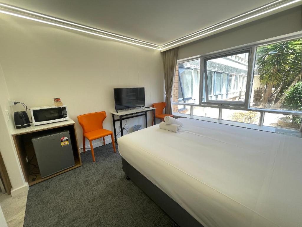 Postel nebo postele na pokoji v ubytování Kingsway Motel Geelong