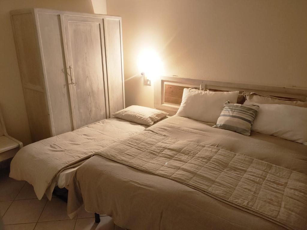 Postel nebo postele na pokoji v ubytování Ca Borgo Alpino