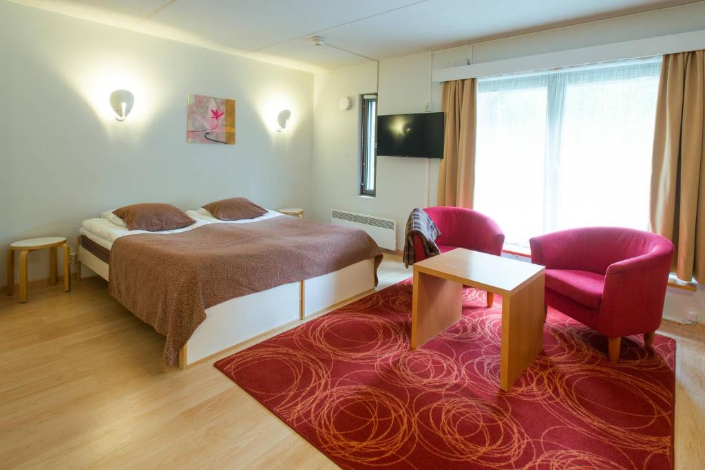 En eller flere senge i et værelse på Holiday Club Rukatunturi Apartments