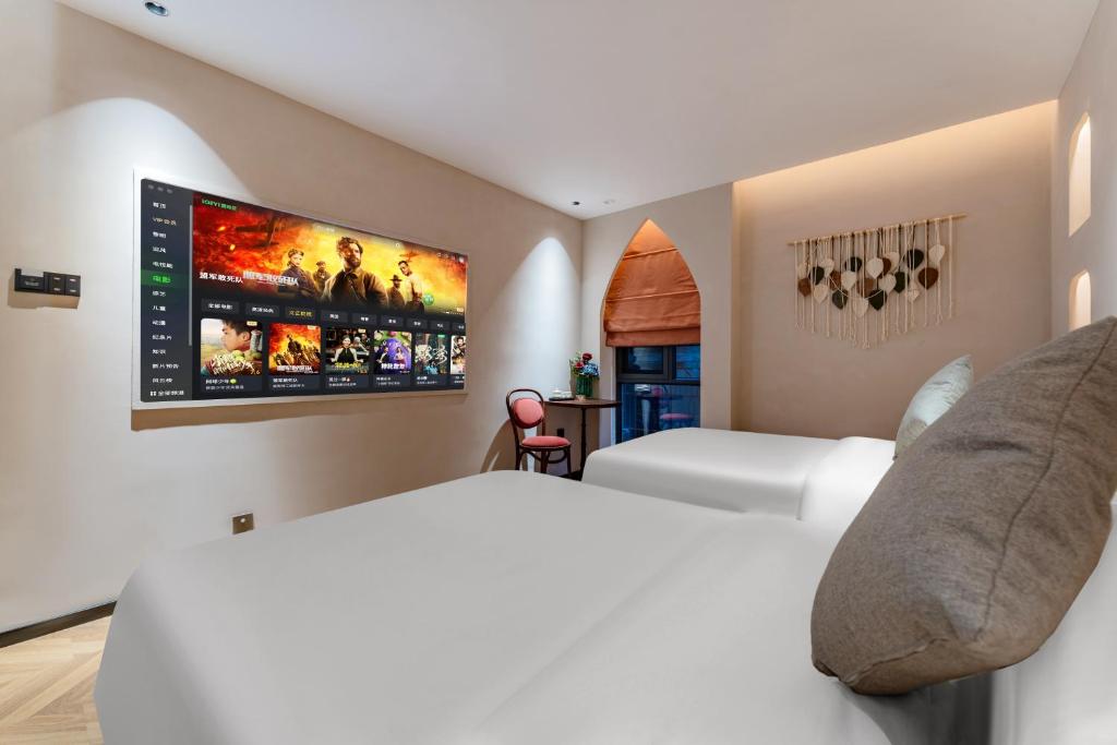 TV a/nebo společenská místnost v ubytování Chaozhou Fanhuali B&B