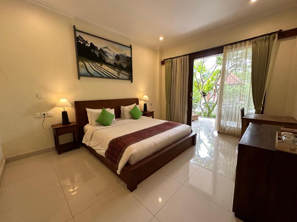 Postel nebo postele na pokoji v ubytování Brata Cottage Ubud