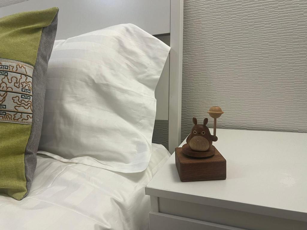 Postel nebo postele na pokoji v ubytování 环球影城附近安静独栋简约新风民宿