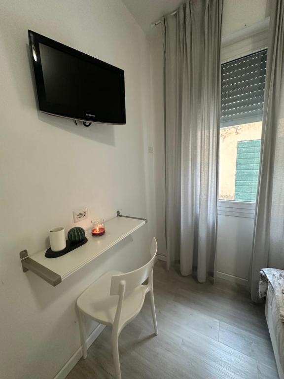 TV a/nebo společenská místnost v ubytování Albergo del Pozzo