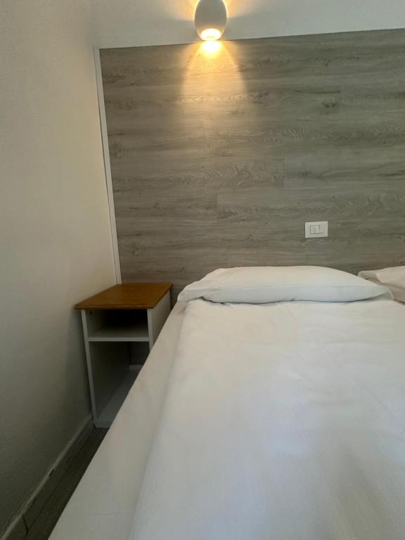 Postel nebo postele na pokoji v ubytování Albergo del Pozzo