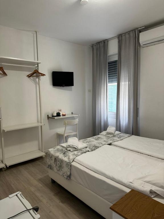 Postel nebo postele na pokoji v ubytování Albergo del Pozzo