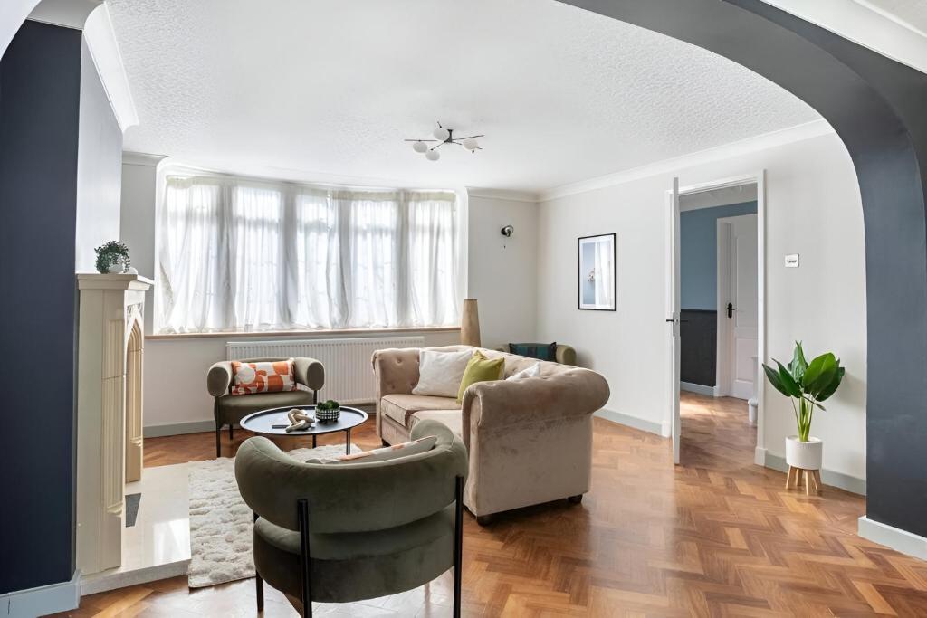 a living room with a couch and two chairs at Seaview Symphony Opulent 4BR Haven for Big Groups in Birchington