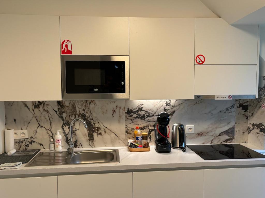 Kuchyň nebo kuchyňský kout v ubytování Nummer 151 villastudios