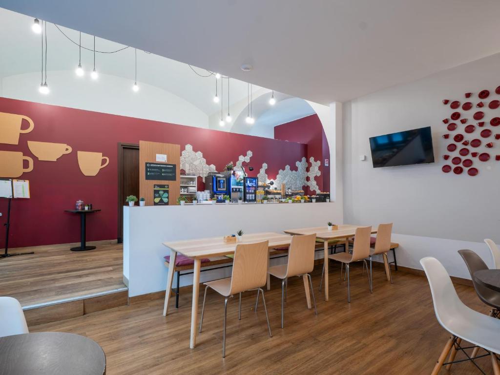 TV a/nebo společenská místnost v ubytování B&B Hotel Trieste