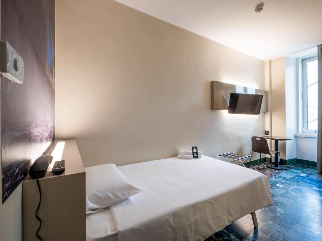 Postel nebo postele na pokoji v ubytování B&B Hotel Trieste