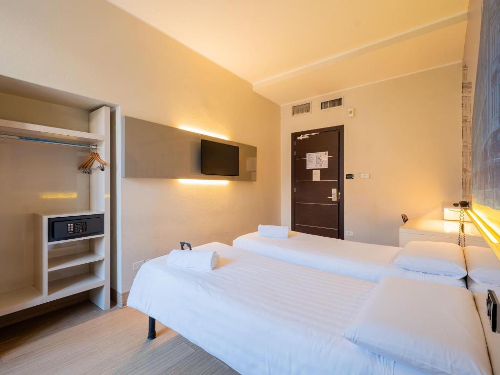 Postel nebo postele na pokoji v ubytování B&B Hotel Trieste