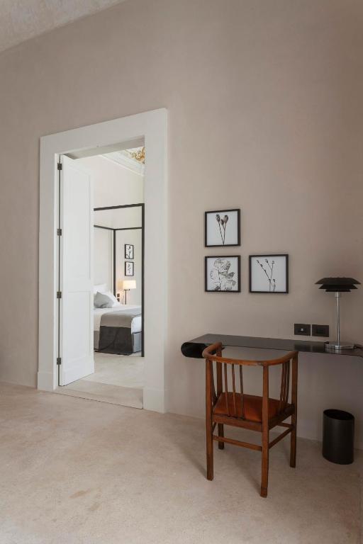 Postel nebo postele na pokoji v ubytování Palazzo Tafuri Boutique Hotel