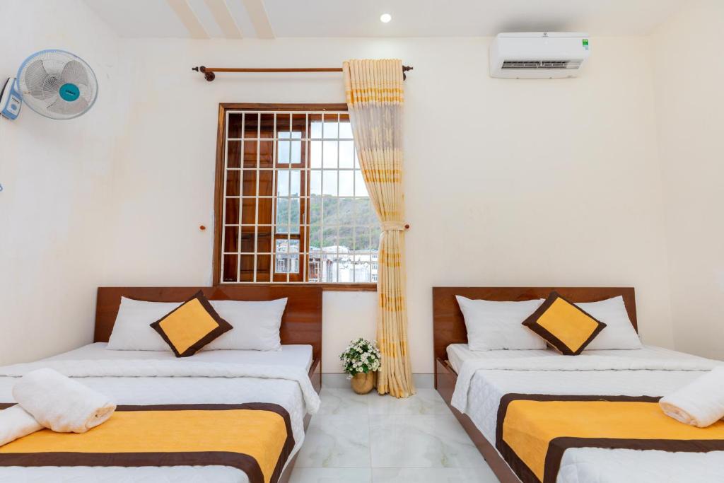 Postel nebo postele na pokoji v ubytování Homestay Bãi Sau - 5 phòng ngủ - 30 Võ Thị Sáu - Free karaoke