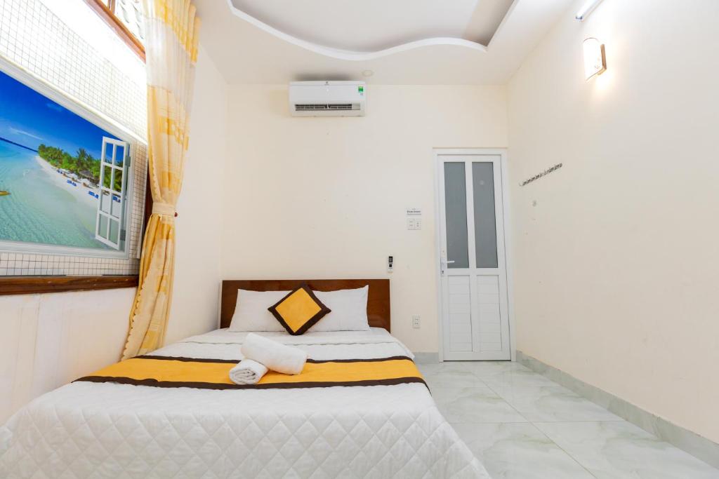 Postel nebo postele na pokoji v ubytování Homestay Bãi Sau - 5 phòng ngủ - 30 Võ Thị Sáu - Free karaoke