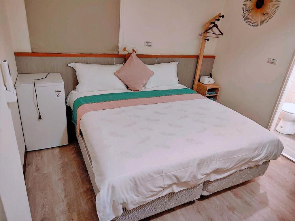 Postel nebo postele na pokoji v ubytování Xianwang Homestay