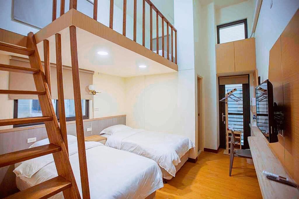 Postel nebo postele na pokoji v ubytování Xianwang Homestay