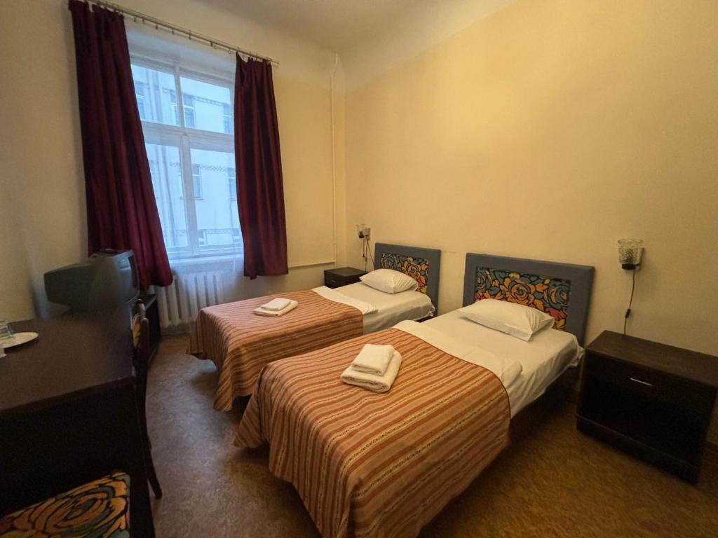 Postel nebo postele na pokoji v ubytování Hostel Viktorija with Private Rooms