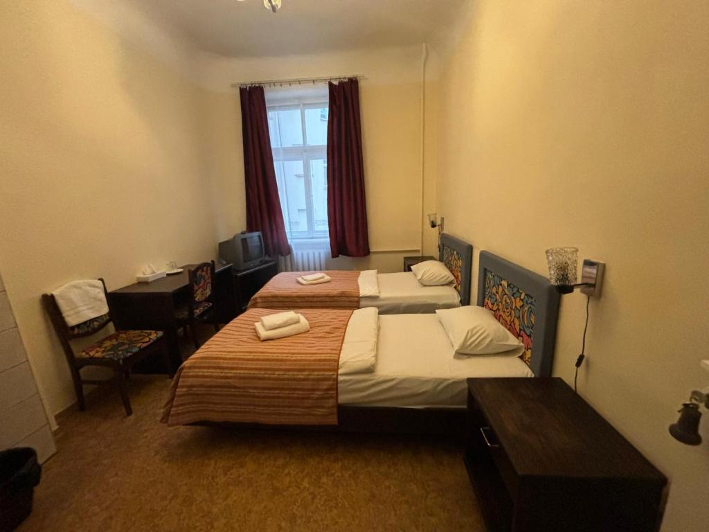 Postel nebo postele na pokoji v ubytování Hostel Viktorija with Private Rooms