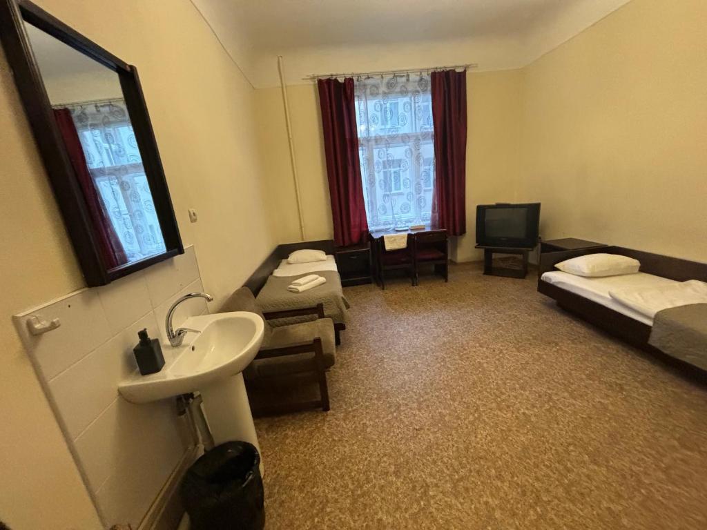 Postel nebo postele na pokoji v ubytování Hostel Viktorija with Private Rooms
