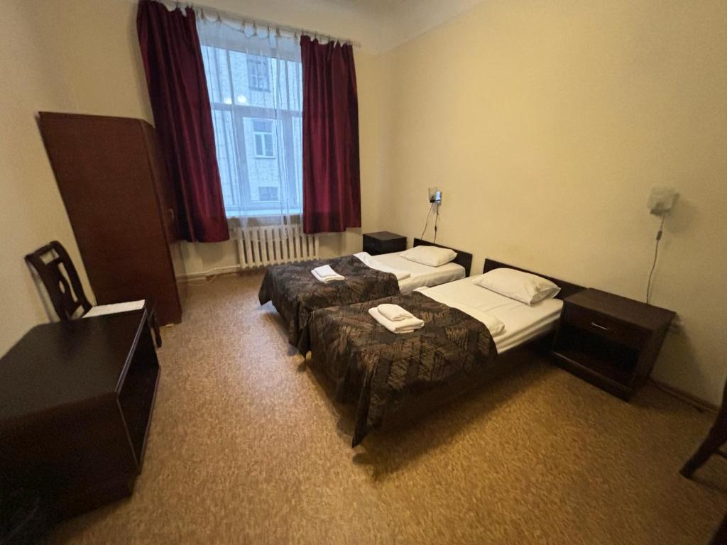 Postel nebo postele na pokoji v ubytování Hostel Viktorija with Private Rooms