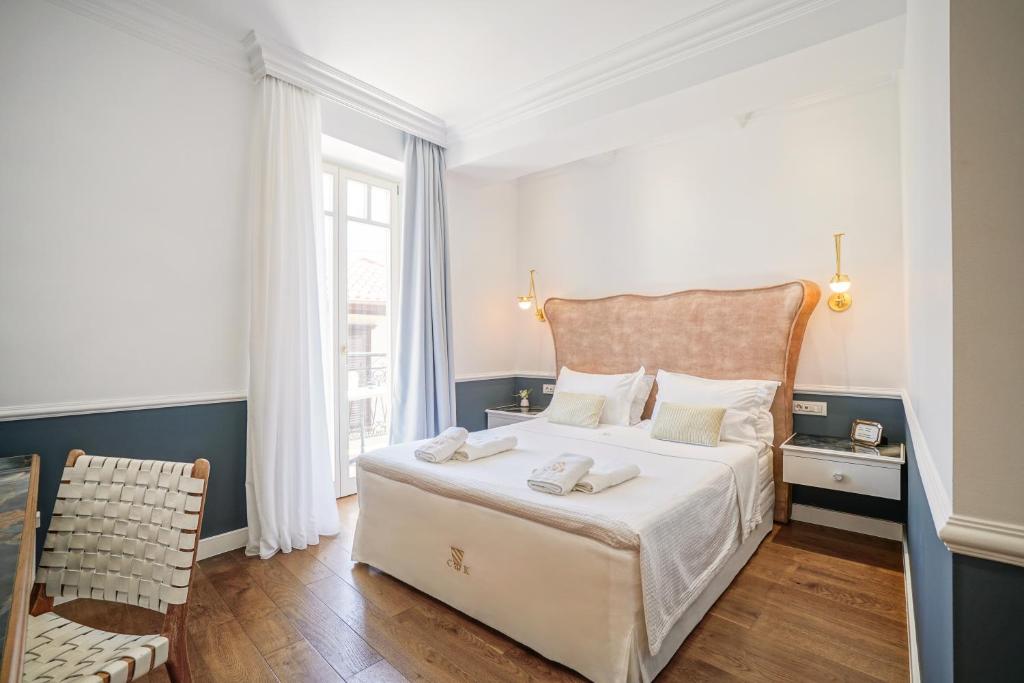 Postel nebo postele na pokoji v ubytování Casa Kallergi